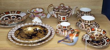 A collection of Royal Crown Derby wares, comprising two paperweights with silver stoppers,