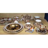 A collection of Royal Crown Derby wares, comprising two paperweights with silver stoppers,