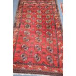 A Bokhara red ground rug, 195 x 110cm