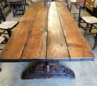 A 17th century style planked top refectory dining table, W.228cm, D.86cm, H.76cm