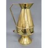 An Aesthetic movement brass communion jug, c.1870, height 49cmCONDITION: There are several dings/