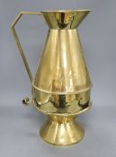 An Aesthetic movement brass communion jug, c.1870, height 49cmCONDITION: There are several dings/