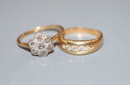 Two early 20th century 18ct and diamond rings, channel set graduated five stone and rose cut diamond