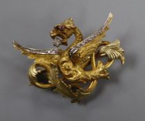A 19th century French two colour yellow metal and diamond chip set dragon brooch, with cabochon eye,