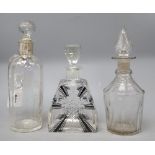 A silver mounted glass claret jug etched 'Whisky', height 26cm, an Art Deco decanter and another