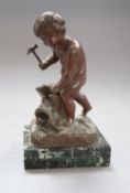 A bronze putto blacksmith, signed H. Capy, on marble base, height 15cm