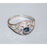 A pierced 18ct white metal, sapphire and diamond cluster dress ring, size G, gross 2.1 grams.