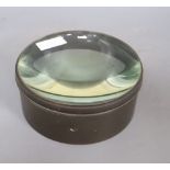 A brass bound optimus magnifying glass, diameter 21cm