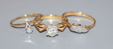 Two 18ct and diamond set dress rings including 1970's, gross 5.3 grams and a 585 and diamond ring,