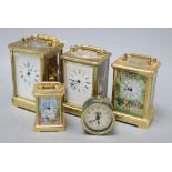 An Asprey brass cased carriage clock, another carriage clocks, two Halcyon Days carriage