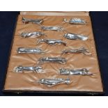 A cased set of twelve Gallia for Christofle Art Deco silver plated knife rests, designed by