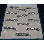 A cased set of twelve Gallia for Christofle Art Deco silver plated knife rests designed by Edouard