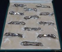 A cased set of twelve Gallia for Christofle Art Deco silver plated knife rests designed by Edouard