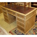 An early 20th century pine pedestal desk, W.130cm, D.63cm, H.73cmCONDITION: Has a replaced