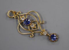 An early 20th century yellow metal, two stone sapphire and three (ex 4) white stone set drop