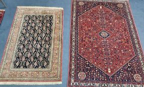A North West Persian red ground rug together with a smaller Boteh part silk mat, larger 154 x 100cm