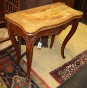 A 19th century French mahogany serpentine folding card table, W.83cm, D.41cm, H.76cmCONDITION: The