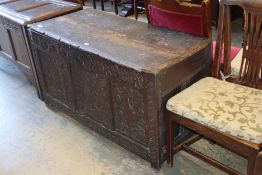 A 17th century carved oak panelled coffer, W.126cm, D.56cm, H.68cm