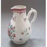 A Chinese export famille rose jug, height 14cmCONDITION: There is a hairline crack reaching over the
