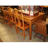 A Chinese dining table and six chairs, table W.216cm, D.86cm, H.84cm