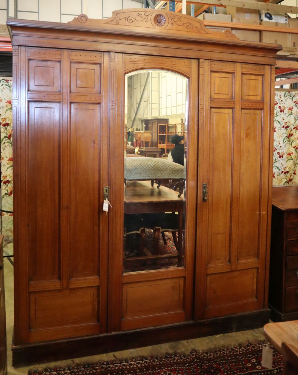 A late Victorian aesthetic movement walnut compactum wardrobe, W.185cm, D.58cm, H.222cmCONDITION: