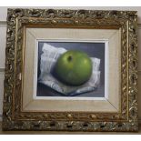 G. Reekie, oil on board, Still life of an apple and newspaper, signed, 11 x 13.5cm