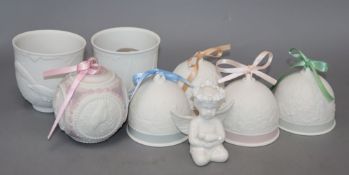 A collection of ceramic bells, Lladro etc.