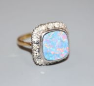 An 18ct, black opal doublet and diamond cluster set dress ring, size N, gross 6.8 grams.CONDITION: A