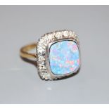 An 18ct, black opal doublet and diamond cluster set dress ring, size N, gross 6.8 grams.CONDITION: A