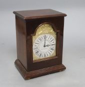 A 'Silver Jubilee' mahogany-cased mantel clock by Charles Frodsham, having arched gilt dial with