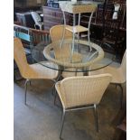 A circular glass top conservatory table, diameter 106cm, four chairs and a matching side table
