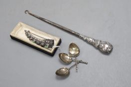 A Chinese silver and hardstone finger ornament with brooch pin, a buttonhook and a set of three