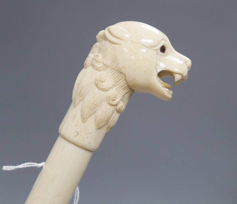 An Indian bone walking cane, with dog handle, c.1960, length 92cm