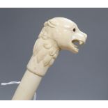 An Indian bone walking cane, with dog handle, c.1960, length 92cm