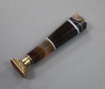 A late Victorian agate handled gilt white metal and carnelian set seal, 68mm.CONDITION: Top of agate