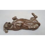 A composite figure of a recumbent dachshund, signed Doris Lindner, length 26cm