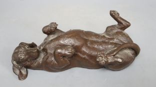 A composite figure of a recumbent dachshund, signed Doris Lindner, length 26cm