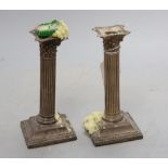 A pair of late Victorian silver corinthian column dwarf candlesticks, Birmingham, 1897, 17cm,