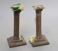 A pair of late Victorian silver corinthian column dwarf candlesticks, Birmingham, 1897, 17cm,