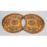 A 19th/20th century Chinese double circular wood and lacquer tray, length 42cm