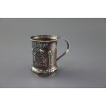 An Edwardian Arts & Crafts planished silver and turquoise cabochon set mug, by Albert Edward