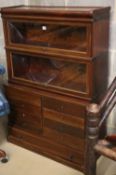 A Globe Wernicke mahogany two section bookcase with eight drawer base section, on plinth base, W.