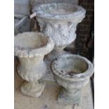 Three reconstituted stone campana garden urns, largest 58cm diameter, H.80cm