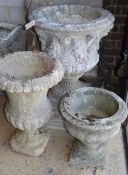 Three reconstituted stone campana garden urns, largest 58cm diameter, H.80cm