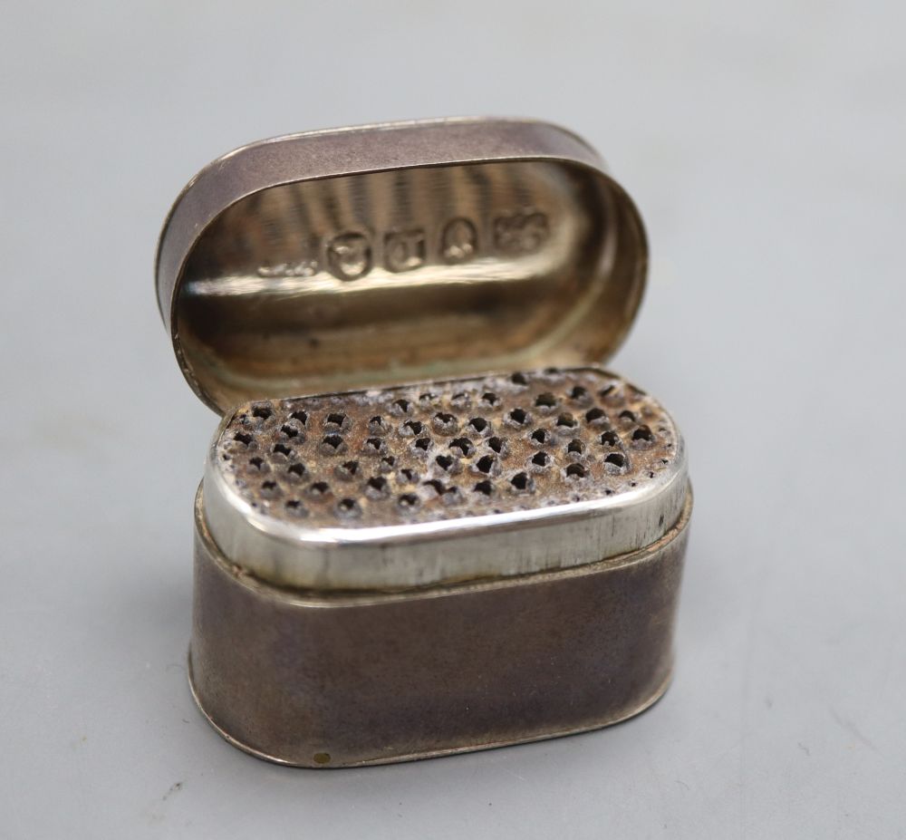 A George III silver oval nutmeg grater, ?B over JM, London, 1806, 34mm.CONDITION: Quite tarnished