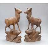 A pair of Black Forest carved deer, c.1860, height 34cm