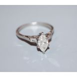 A white metal (stamped plat) and marquise diamond set dress ring with baguette cut diamond set