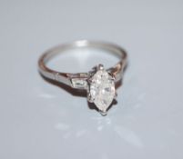 A white metal (stamped plat) and marquise diamond set dress ring with baguette cut diamond set