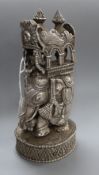 A 20th century Indian white metal model of an elephant with howdah and passengers, height 22.4cm,