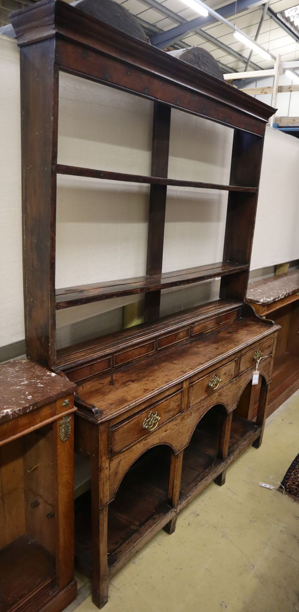 A small George III and later oak dresser, W.125cm, D.36cm, H.184cmCONDITION: Overall a very nice